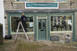 Sarah Jarman signwriting for Alston Wholefoods on 17.10.19